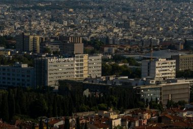 a city with lots of tall buildings and lots of trees